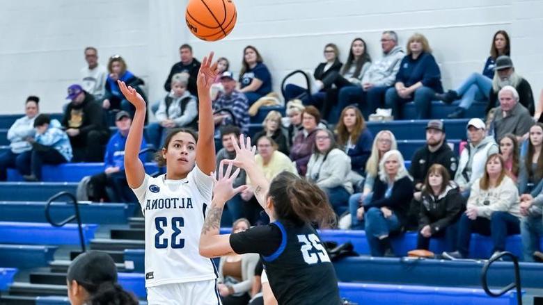 Penn State Altoona student-athlete Avana Sayles playing in a basketball gams